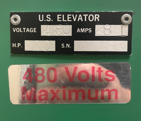 The image depicts a U.S. elevator control panel displaying technical specifications, including a voltage of 4480 volts, 20 horsepower, and a maximum capacity of 480 volts.AI-generated content may be incorrect.
