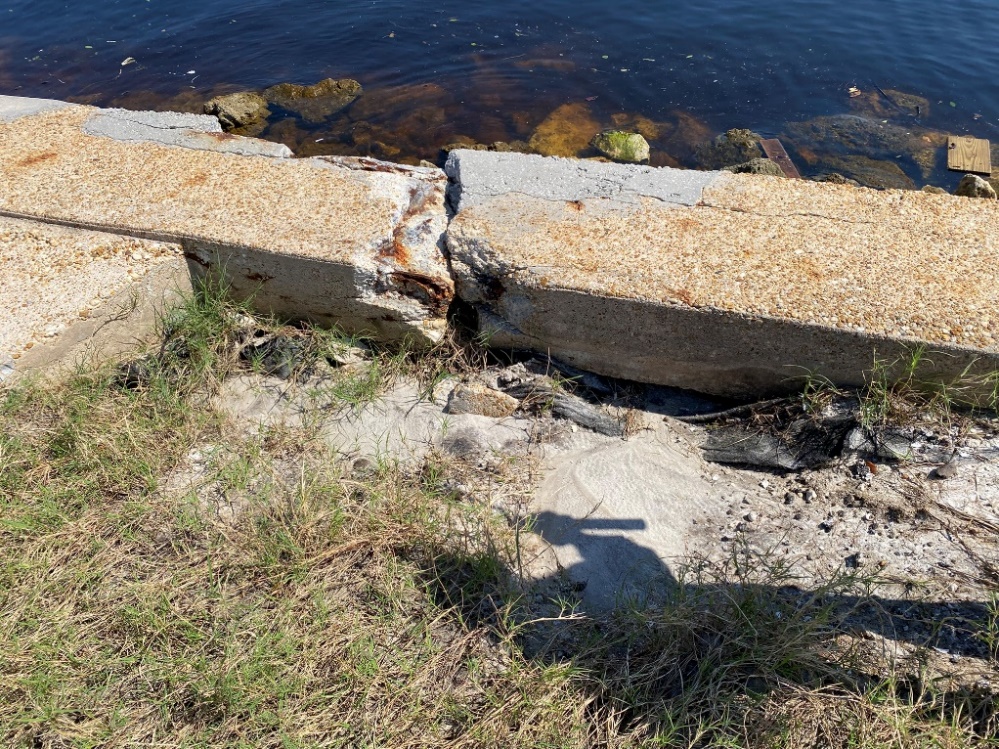 A concrete block near waterDescription automatically generated with medium confidence