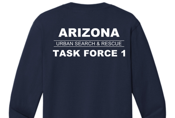 A long sleeved blue shirt with white textAI-generated content may be incorrect.